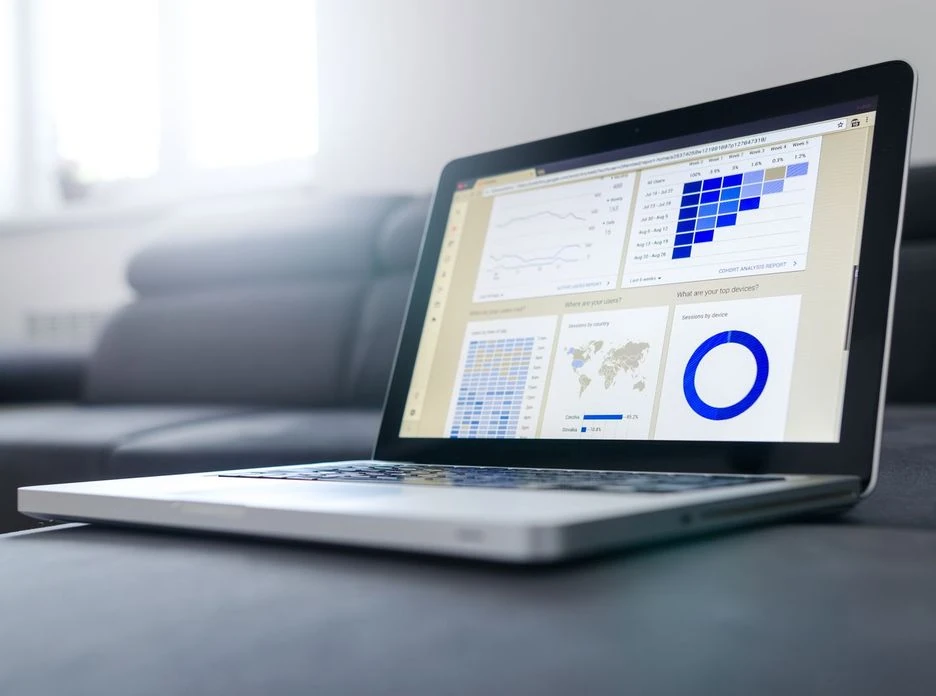 Sleek laptop showcasing data analytics and graphs on the screen in a bright room