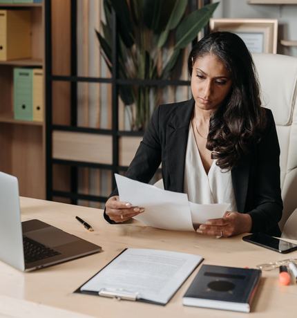 A woman working at a desk in an office