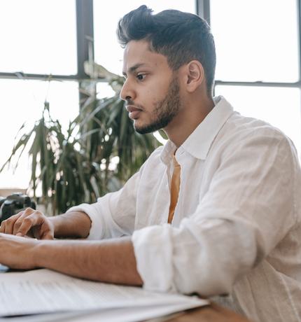 A man working on a laptop at a desk